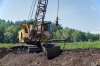 30545332-Old-dragline-excavator-on-the-peat-quarry-in-the-swamp-Stock-Photo.jpg