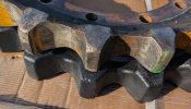 Removing_CAT_305_5E2_Sprocket_Compare_Worn_Teeth.jpg